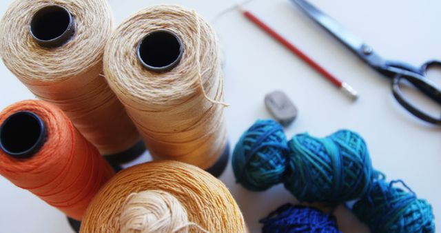 Spools of thread and sewing accessories on a table, with copy space - Download Free Stock Photos Pikwizard.com