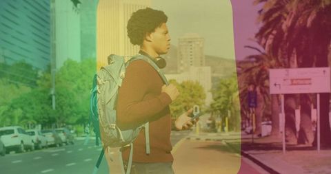 Young Male Tourist Navigates City Streets with Smartphone and Backpack