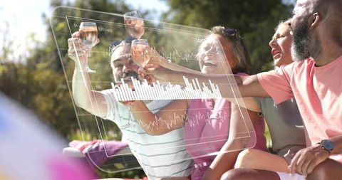 Friends toasting with rosé and augmented reality data visuals on sunny patio for social tech celebra