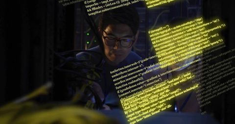Korean it technician tracing server cables with floating code overlay in neon datacenter
