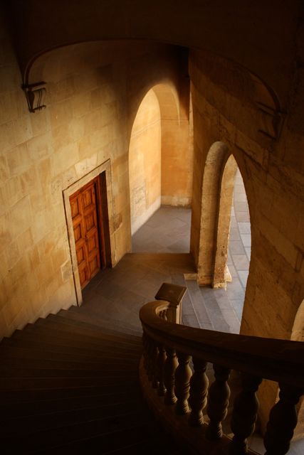 Ancient Curved Staircase with Arched Doorway in Mediterranean Sunlight - Download Free Stock Photos Pikwizard.com