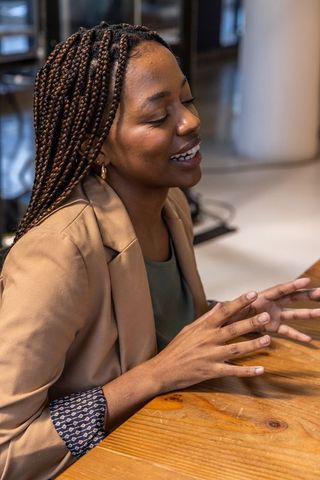 Confident businesswoman engaging in corporate meeting