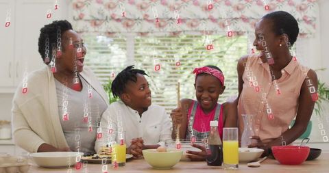 Multigenerational black family cooking together on bright kitchen island