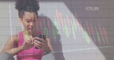 Fit Young Woman Analyzing Financial Data on Smartphone