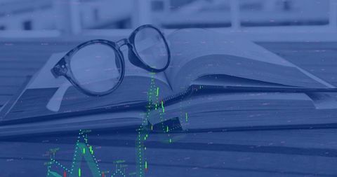 Intellectual insights: eyeglasses on open book with candlestick chart overlay