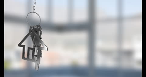 House-Shaped Keyring Suspended with Blurred Background