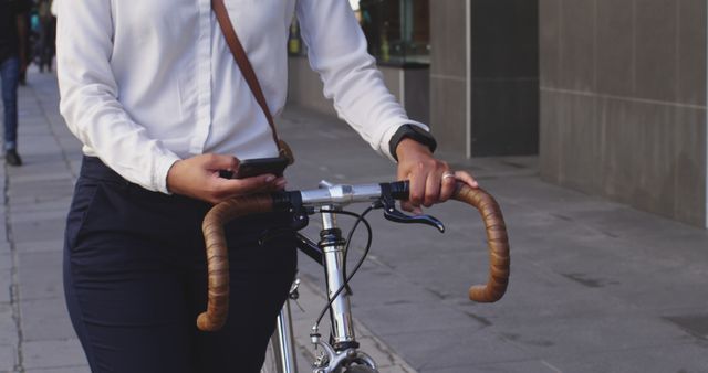 Person Walking with Bicycle on Urban Sidewalk - Download Free Stock Images Pikwizard.com