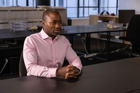 Focused african american professional in minimalist workspace