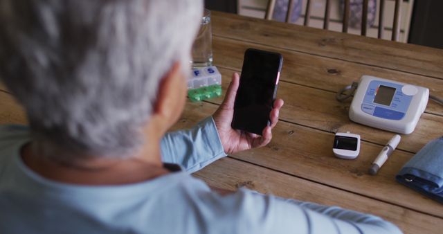 Senior Man Managing Health Using Smartphone and Medical Devices - Download Free Stock Images Pikwizard.com