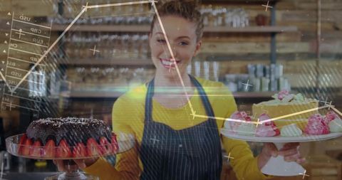 Smiling pastry chef displaying array of delicious bakery treats