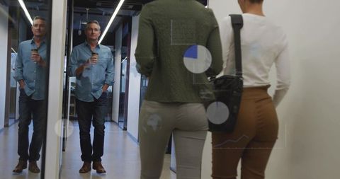 Professional Colleagues Walking in Office Corridor with Data Visualization Overlays