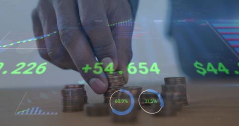 Executive stacking coins with financial dashboard showing growth metrics and insights