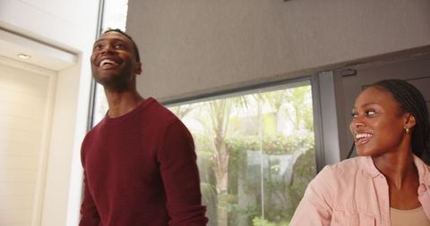 Joyful Couple Relaxing in Contemporary Home Interior