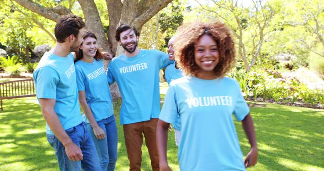 Diverse Group of Volunteers in Blue T-Shirts Enjoying Outdoor Event - Download Free Stock Images Pikwizard.com