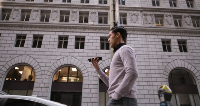 Businessman Walking in Modern City with Smartphone - Download Free Stock Images Pikwizard.com