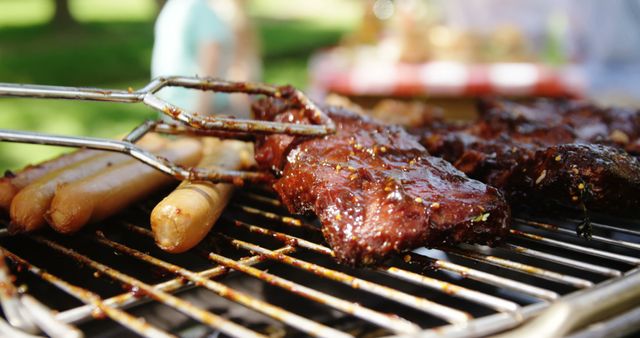 Sizzling sausages and marinated meat cook on a barbecue grill, capturing a moment of outdoor culinary delight. Barbecues symbolize leisurely gatherings and the enjoyment of grilled flavors in the company of friends and family.