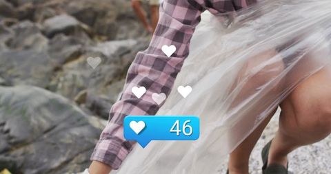 Person wrapping transparent film on beach with social media elements