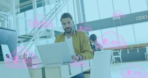 Diverse business team in modern office with cloud computing graphics