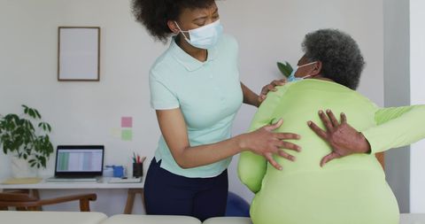 Female Physiotherapist Assisting Senior Patient During Pandemic - Download Free Stock Images Pikwizard.com