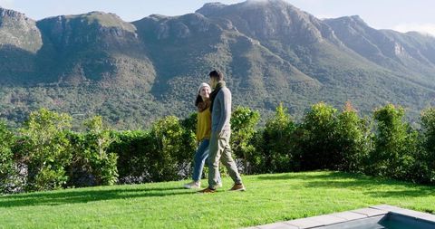 Romantic Couple Walking Through Scenic Mountainous Landscape