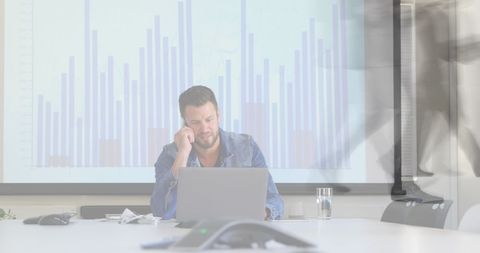 Businessman Analyzing Data with Blurred Robotics Figures - Download Free Stock Images Pikwizard.com