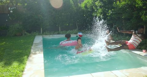 Friends Enjoying Summer Fun in Backyard Pool