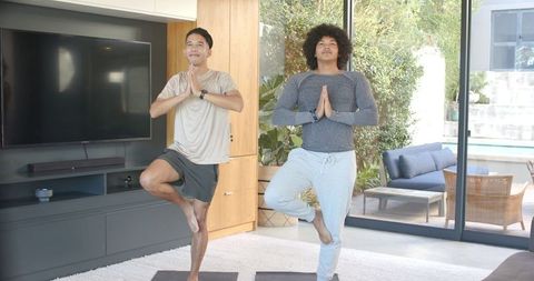 Diverse Friends Practicing Yoga at Home in Tranquil Living Space