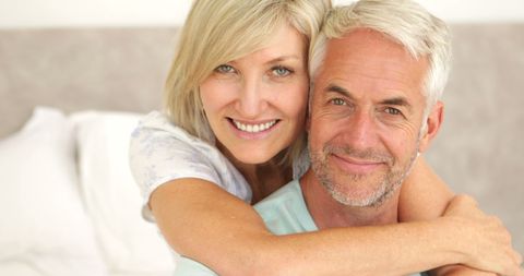 Happy Senior Couple Embracing in Bedroom - Download Free Stock Images Pikwizard.com