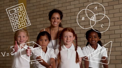 Diverse Schoolchildren and Teacher with Education Symbols in Classroom