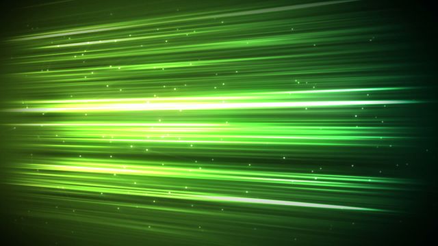 This vibrant video showcases dynamic green light streaks with sparkles on a dark background. Perfect for representing speed, futuristic themes, digital technology, and energetic designs. Ideal for backgrounds in technology blogs, sci-fi artwork, dynamic video elements, or promotional material highlighting progress and innovation.