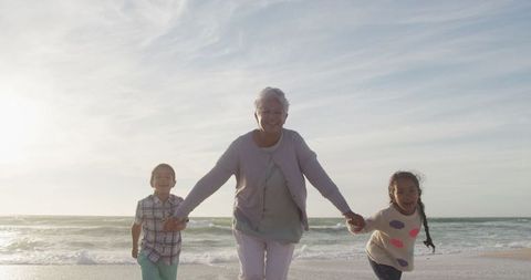 Joyful Grandmother and Grandchildren Enjoying Sunset Beach Moment