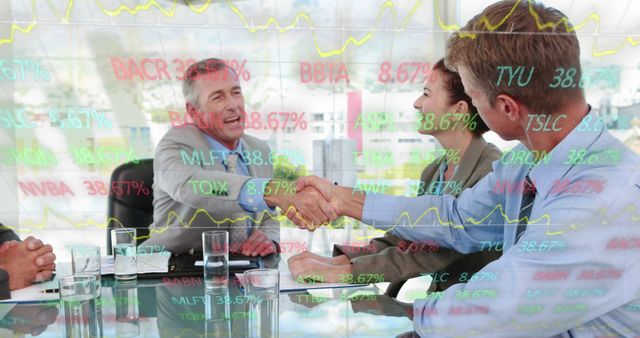 Diverse team of professionals having business meeting in modern office, with handshake signaling agreement and partnership. Stock market numbers overlay adds financial and investment context, suggests themes of success, finance, trading and corporate collaboration. Suitable for illustrating concepts related to business deals, financial planning, corporate meetings and investment strategies.