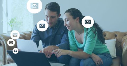 Couple Collaborating on Digital Technology with Envelope Icons - Download Free Stock Images Pikwizard.com