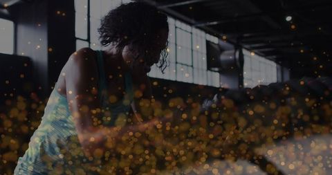 Determined woman exercising with digital transformation overlay