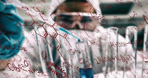 Scientist Analyzing Molecular Structures on Transparent Board