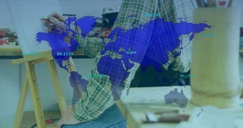 Artisan drafting at workbench with global map overlay