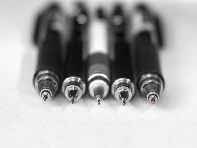 Five different pens arranged closely together on a white background, ideal for use in articles or promotional materials about stationery, office supplies, writing, or educational tools. The image can be used for blog posts related to writing instruments or school supplies.