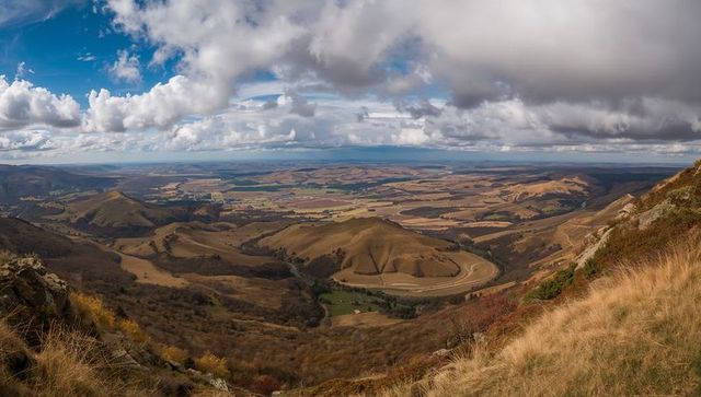 Breathtaking hilltop panorama overlooking vast rural valley