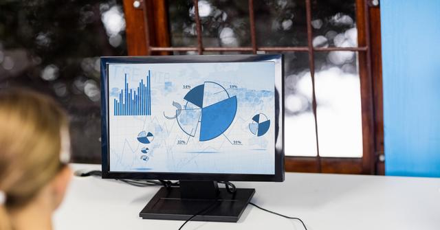 This image is ideal for illustrating concepts related to data analysis, business intelligence, and professional working environments. It can be used in articles, blog posts, websites, and presentations that cover topics such as data visualization, office settings, statistics tracking, and business analysis.