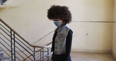 African American Woman Wearing Protest Mask in Urban Space