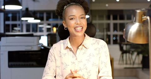 African American Businesswoman Smiling in Contemporary Office