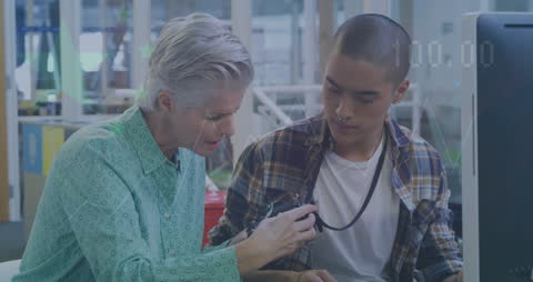 Business Colleagues Discussing Financial Data in Office