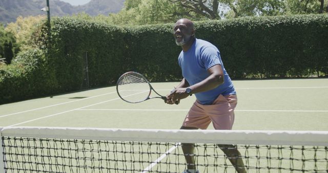 Senior Man Playing Tennis on Outdoor Court in Summertime - Download Free Stock Images Pikwizard.com