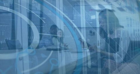 Businesswoman Innovating Amidst Data Projections in Modern Office