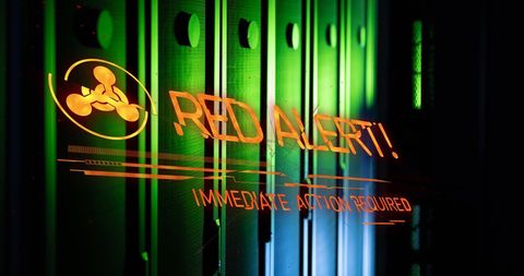 Red alert warning in server room symbolizing urgency and threat