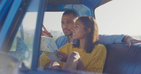 Carefree Couples Planning Route on Road Trip Journey - Download Free Stock Images Pikwizard.com
