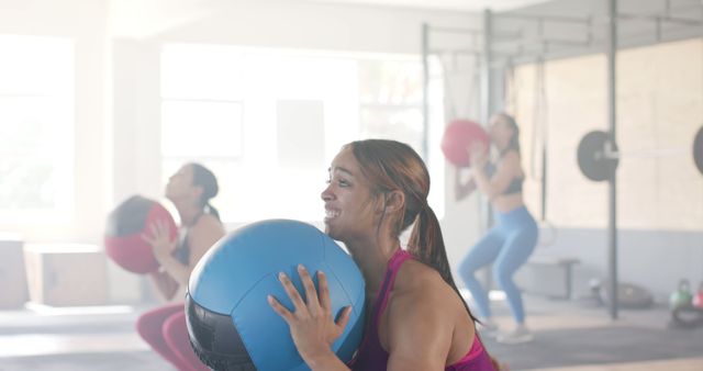Diverse group of female friends doing squats with ball at gym - Download Free Stock Photos Pikwizard.com