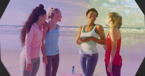 Friends Enjoying Beach Workout in Colorful Activewear