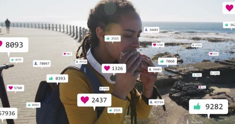 Woman Enjoying Sandwich by Ocean with Social Media Icons
