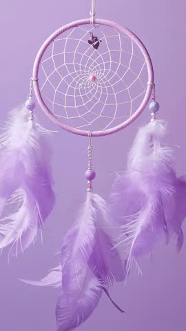 Lavender dreamcatcher swaying with purple feathers and pink beads vertical calming loop